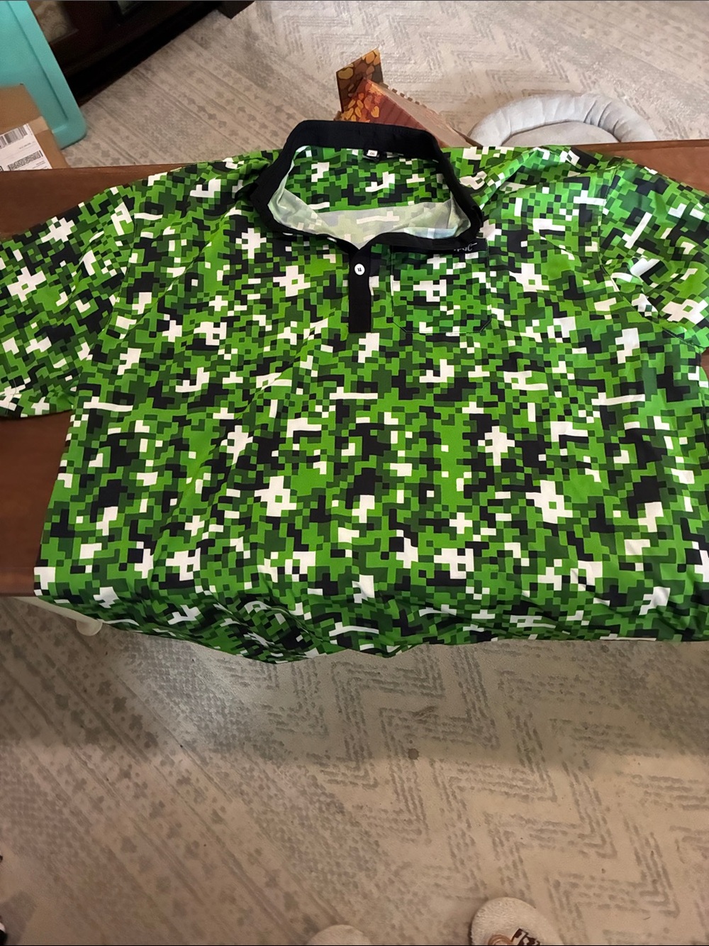 Men's Green Pixel Camo Polo Shirt with Contrast Collar. Brand new without tags